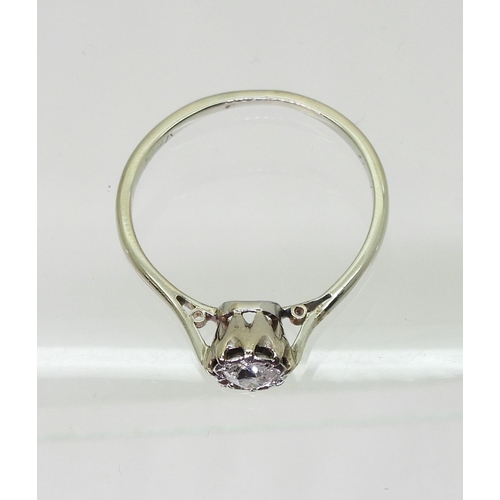 704 - An old cut diamond solitaire in a classic white metal crown mount, the diamond is estimated approx 0... 