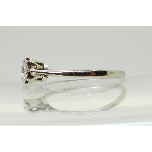 704 - An old cut diamond solitaire in a classic white metal crown mount, the diamond is estimated approx 0... 