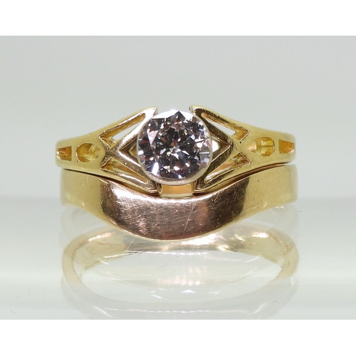 706 - An 18ct gold Celtic design ring set. The engagement ring is set with an estimated approx 0.60ct soli... 