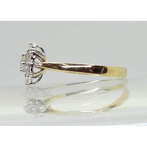 707 - An 18ct gold diamond flower ring, set with estimated approx 0.75cts of brilliant cut diamonds, finge... 