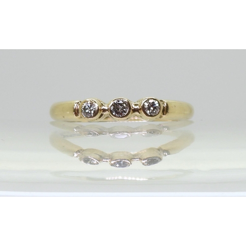 708 - A 9ct three stone diamond ring, bearing Sheffield hallmarks for 1988, set with three brilliant cut d... 