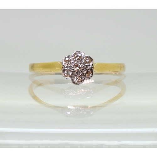 709 - An 18ct gold diamond flower ring set with estimated approx 0.15cts of eight cut diamonds, finger siz... 