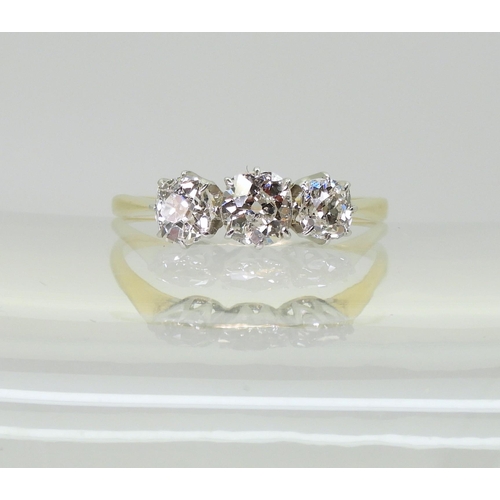 715 - A classic three stone diamond ring, set with estimated approx 1ct of old cut diamonds, in classic ye... 