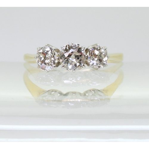 715 - A classic three stone diamond ring, set with estimated approx 1ct of old cut diamonds, in classic ye... 