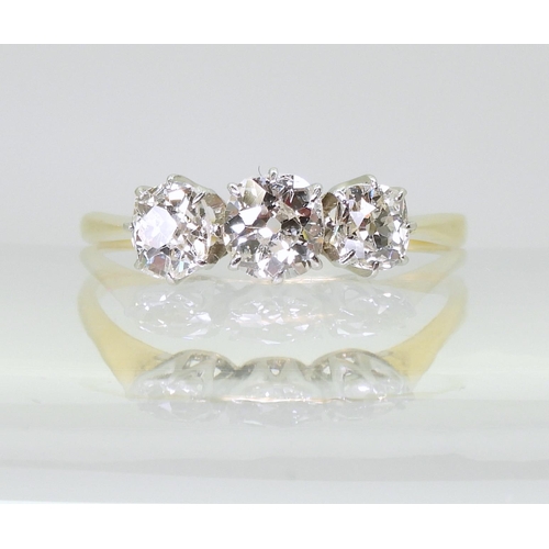 715 - A classic three stone diamond ring, set with estimated approx 1ct of old cut diamonds, in classic ye... 