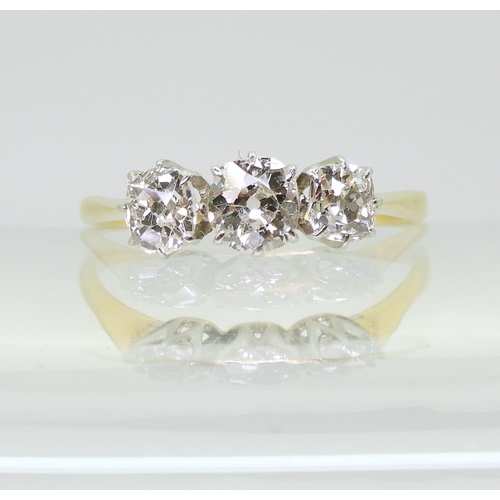 715 - A classic three stone diamond ring, set with estimated approx 1ct of old cut diamonds, in classic ye... 