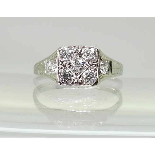 722 - A vintage diamond cluster ring, set with estimated approx 0.70cts of old cut diamonds, to the white ... 