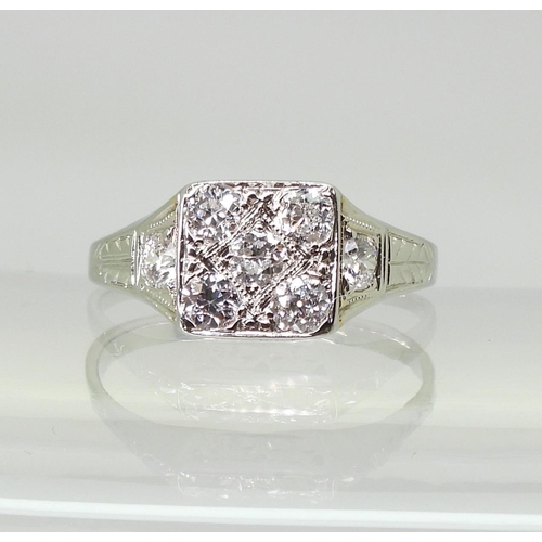 722 - A vintage diamond cluster ring, set with estimated approx 0.70cts of old cut diamonds, to the white ... 