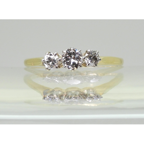 727 - An 18ct gold and platinum classic three stone ring, set with estimated approx 0.50cts in total. fing... 