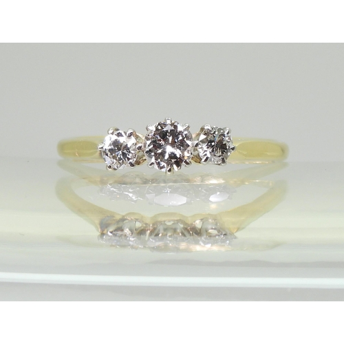 727 - An 18ct gold and platinum classic three stone ring, set with estimated approx 0.50cts in total. fing... 