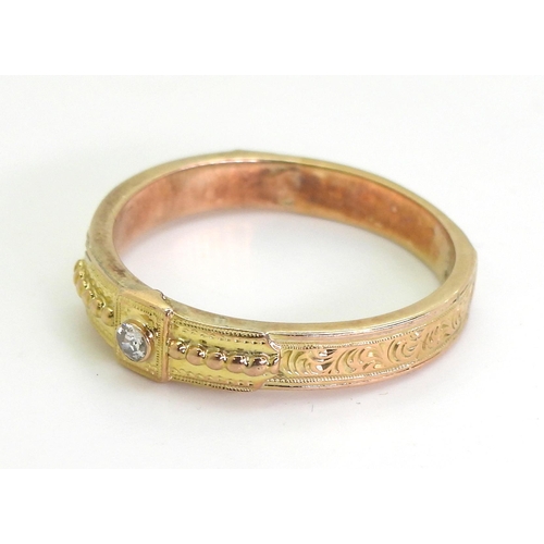 738 - A vintage yellow metal diamond set band ring, set with an estimated approx 0.05ct old cut diamond, f... 