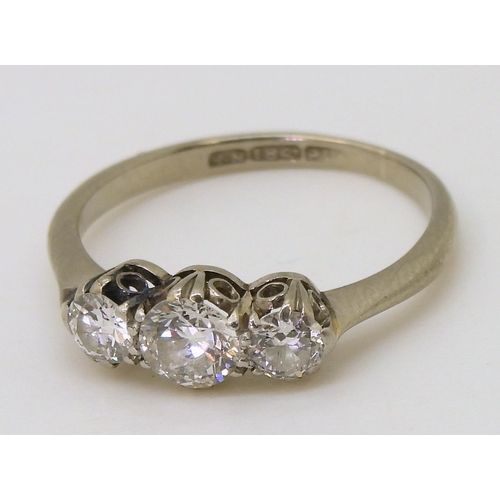 739 - A classic 18ct white gold and platinum three stone diamond ring, set with estimated approx 0.60ct ol... 