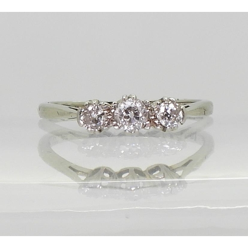 745 - An 18ct white gold and platinum classic three stone diamond ring, set with estimated approx 0.20cts ... 