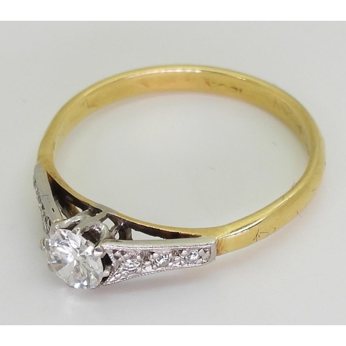 746 - An 18ct yellow and white gold diamond solitaire of estimated approx 0.30cts, with further diamonds m... 