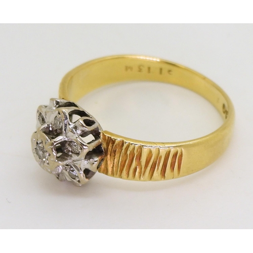 750 - An 18ct gold diamond retro flower ring set with diamond accents, and bark textured shoulders, finger... 