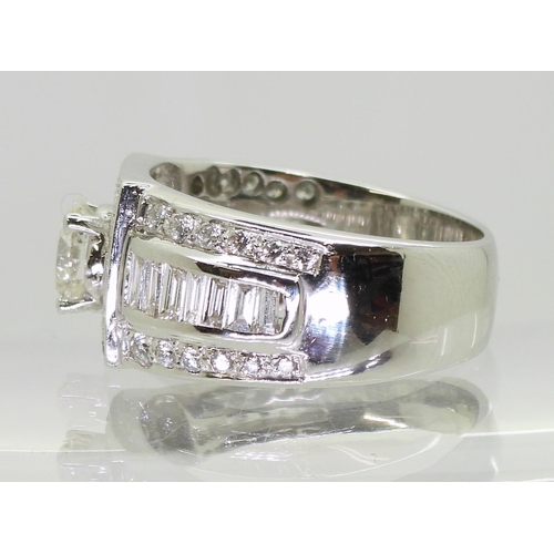 751 - A white metal gents diamond cluster ring, with a central brilliant cut diamond of estimated approx 1... 