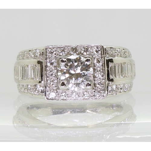 751 - A white metal gents diamond cluster ring, with a central brilliant cut diamond of estimated approx 1... 