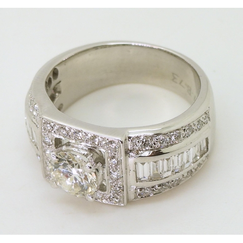 751 - A white metal gents diamond cluster ring, with a central brilliant cut diamond of estimated approx 1... 