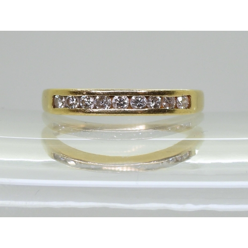 753B - An 18ct gold half eternity ring set with estimated approx 0.25cts of brilliant cut diamonds, finger ... 