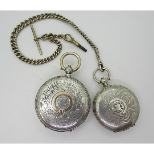 760 - A silver open face pocket watch, the decorative dial example with yellow metal Roman numerals, Chest... 