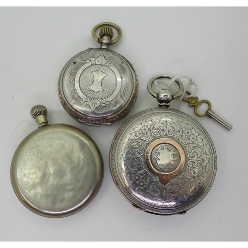 763 - A large silver pocket watch with a decorative dial, diameter 5.8cm, London hallmarks for 1890, a con... 