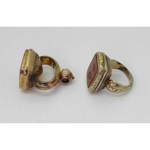 764 - A Victorian seal ring, in rolled gold with monogramed carnelian seal stone, approximately O1/2, and ... 