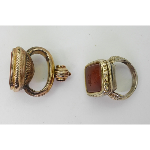 764 - A Victorian seal ring, in rolled gold with monogramed carnelian seal stone, approximately O1/2, and ... 