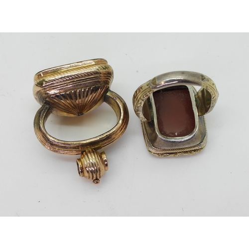 764 - A Victorian seal ring, in rolled gold with monogramed carnelian seal stone, approximately O1/2, and ... 