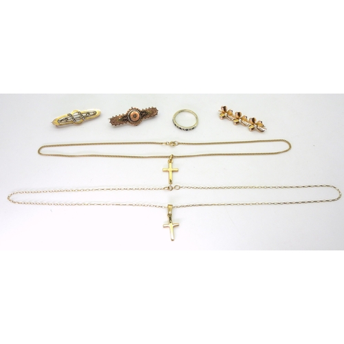 793 - Two 9ct gold crosses on chains, a 10k gold pearl three shamrock brooch, and two others and a 9ct gol... 