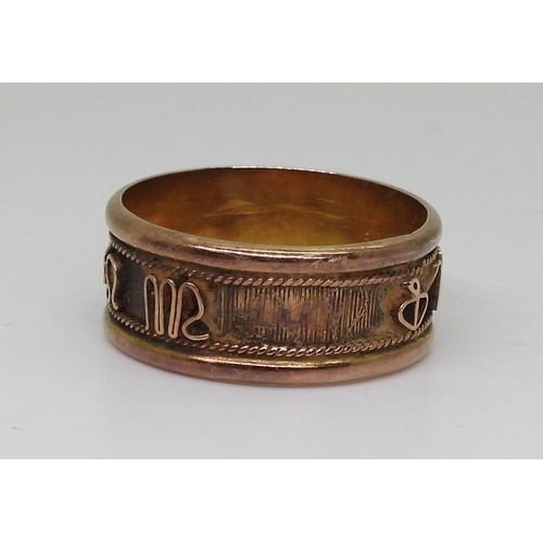 805 - An 18k gold ring with zodiac symbols, size V, weight 4.7gms