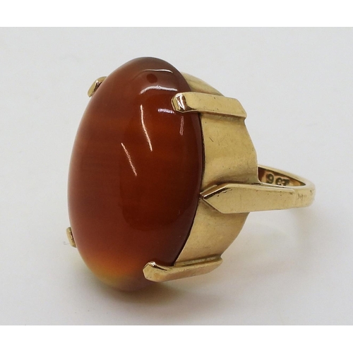 813 - A 9ct gold mounted large banded carnelian ring, size Q1/2, weight 9.1gms