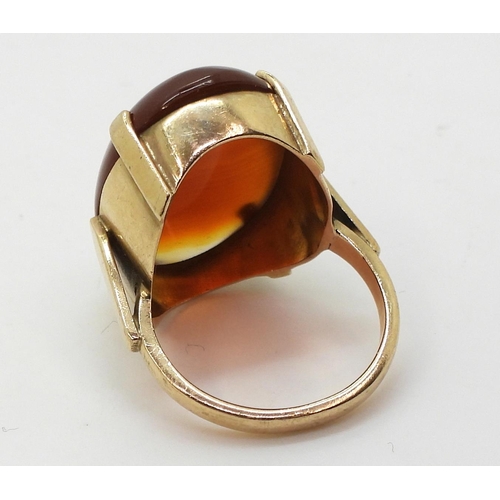 813 - A 9ct gold mounted large banded carnelian ring, size Q1/2, weight 9.1gms