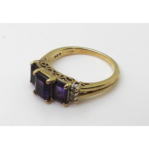 816 - A 9ct gold amethyst three stone with diamond accent shoulders, finger size P1/2, weight 3.6gms