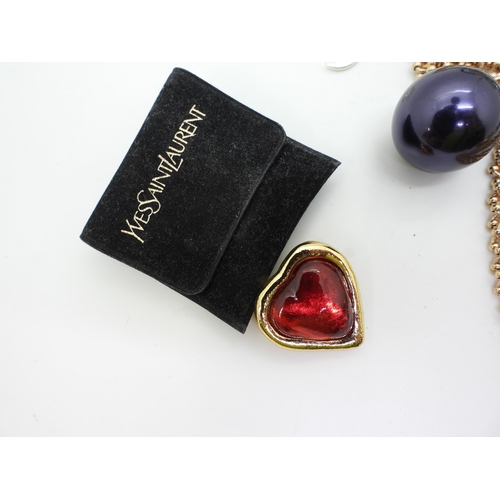 837 - A Yves St. Laurent 'Jelly Heart' brooch, an eclectic statement necklace by Mawi of London with a gol... 