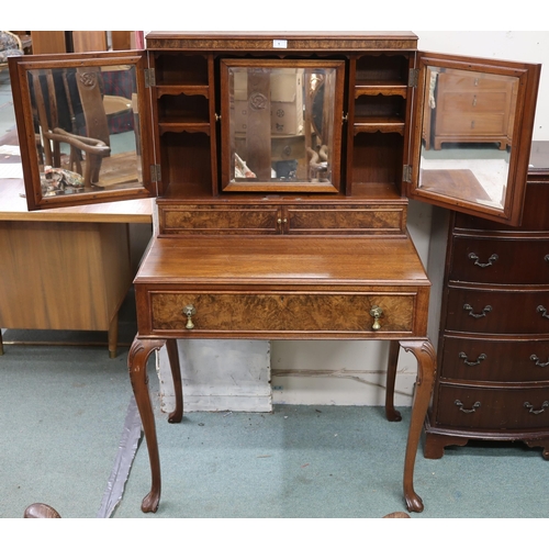 1 - An early 20th century mahogany and walnut veneered dressing table with pair of panel doors with mirr... 