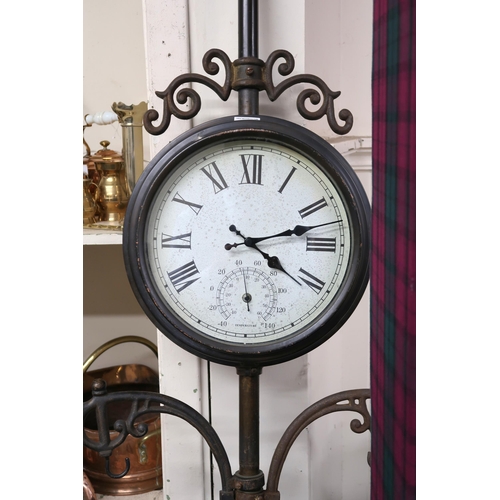 22 - A 20th century free standing architectural style double sided garden clock, 173cm high