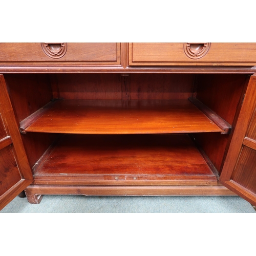 36 - A 20th century Chinese hardwood sideboard with shaped rectangular top over four short drawers over t... 