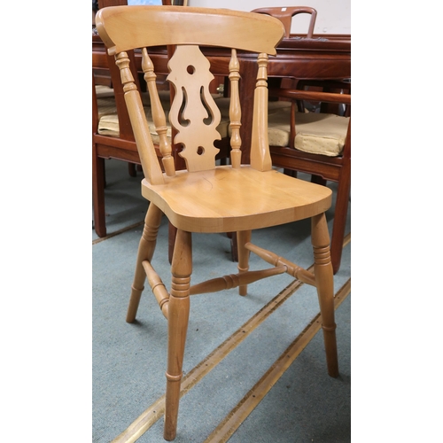 39 - A 20th century pine extending dining table and six chairs, table oval extending top with single leaf... 