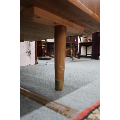 47 - A mid 20th century teak desk with shaped rectangular top over to banks of drawers on tapering suppor... 