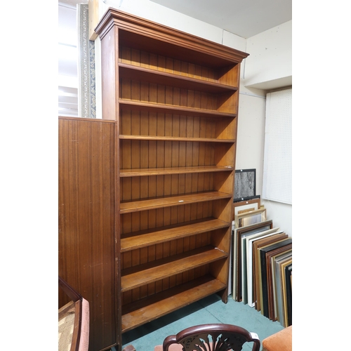 53 - A large 20th century open bookcase with moulded cornice over eight open shelves, 238cm high x 125cm ... 