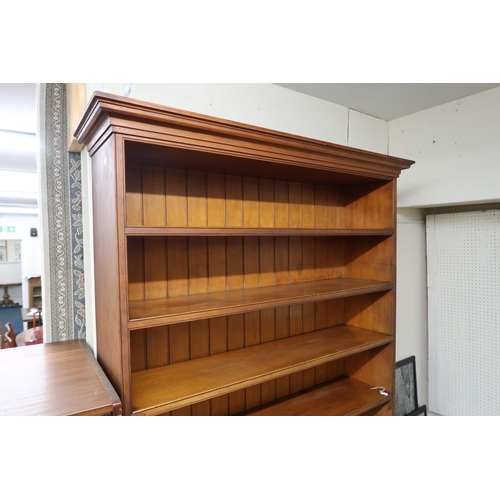 53 - A large 20th century open bookcase with moulded cornice over eight open shelves, 238cm high x 125cm ... 