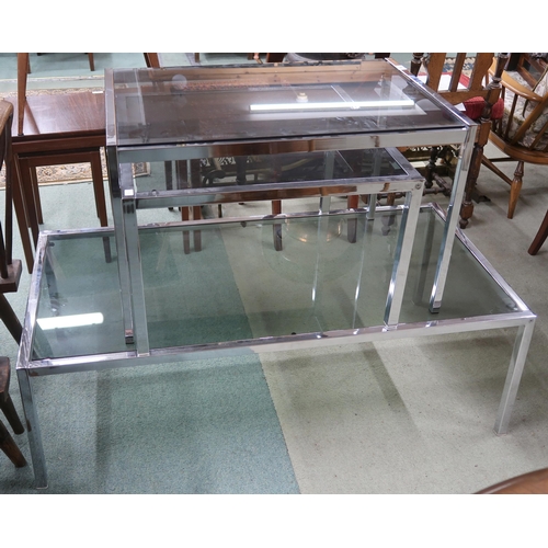 80 - A lot of three assorted chrome framed smoked glass topped coffee tables, largest, 37cm high x 122cm ... 