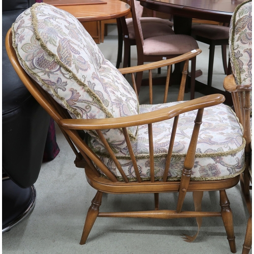 84 - A pair of mid 20th century Ercol elm and beech rail backed armchairs, 90cm high x 70cm wide x 90cm d... 