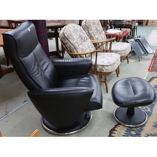 85 - A 20th century G Plan black vinyl upholstered swivel reclining armchair, 105cm high x 80cm wide x 80... 