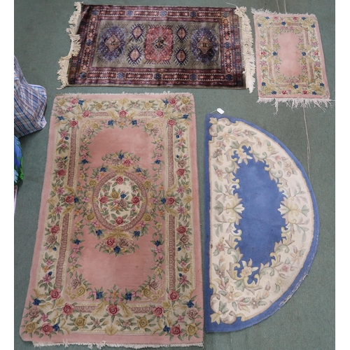 89 - A lot comprising green ground Persian style rug, 125cm high x 78cm wide, pink oriental style rug, 15... 