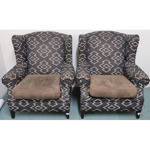 94 - A pair of 20th century upholstered wingback armchairs on square tapering supports, 99cm high x 88cm ... 