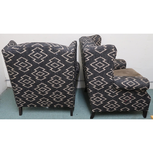 94 - A pair of 20th century upholstered wingback armchairs on square tapering supports, 99cm high x 88cm ... 