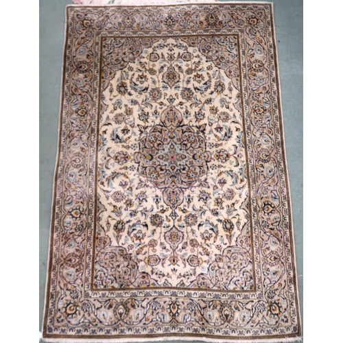 86 - A cream ground Meshed rug with multicolour flower head central medallion, matching spandrels and flo... 