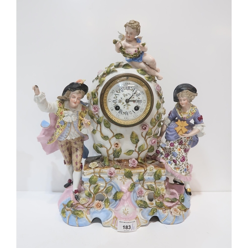 183 - A continental ceramic clock with figures and a cherub, together with another figure of a man with a ... 