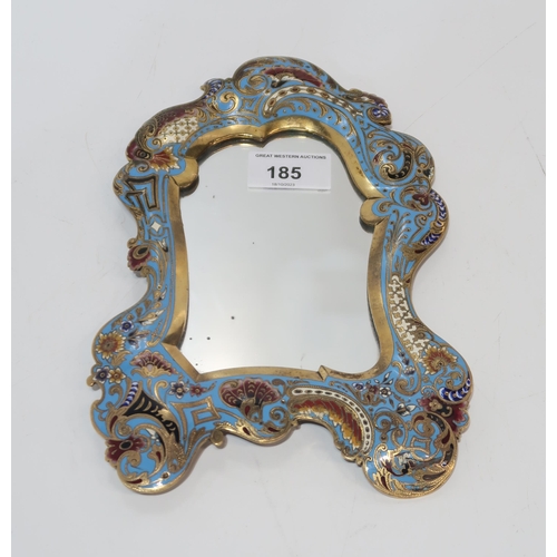 185 - A champleve enamelled mirror, of rococo style